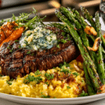 New York Steak with Blue Cheese Butter; Tequila & Butter Glazed fresh Carrot Flambé; Slow Cooked Saffron Risotto; grilled Asparagus Spears with Toasted Garlic, served with Cabernet Sauvignon